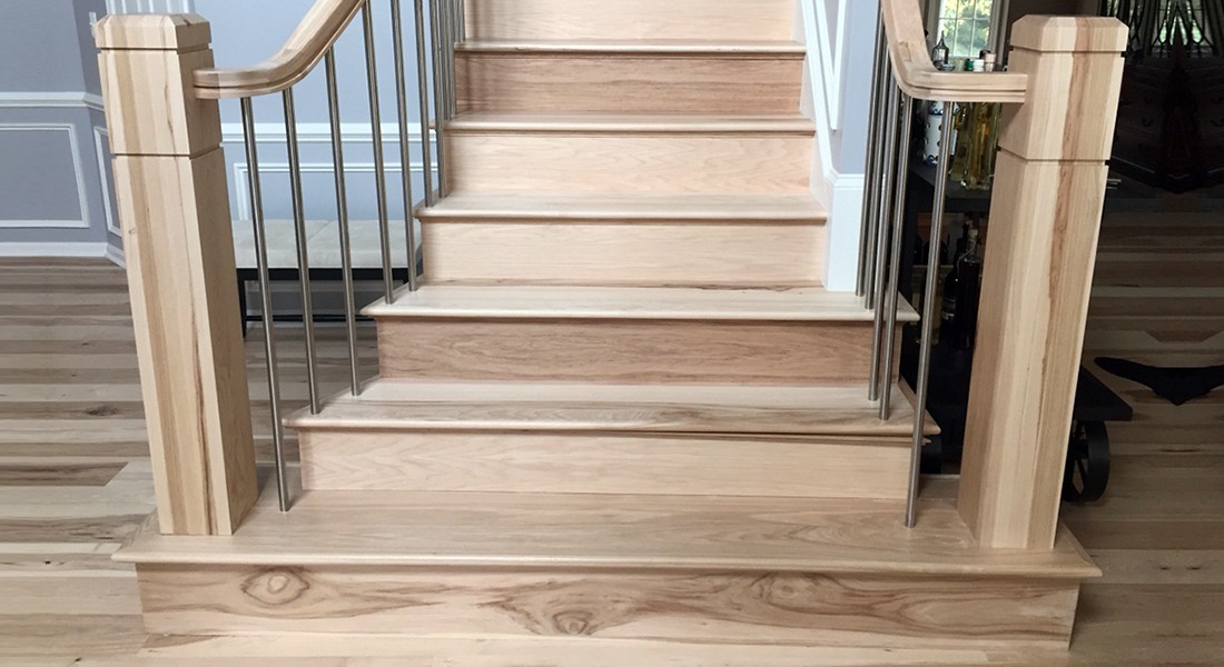 Lvp on stairs whit white risers - RE Flooring, Llc